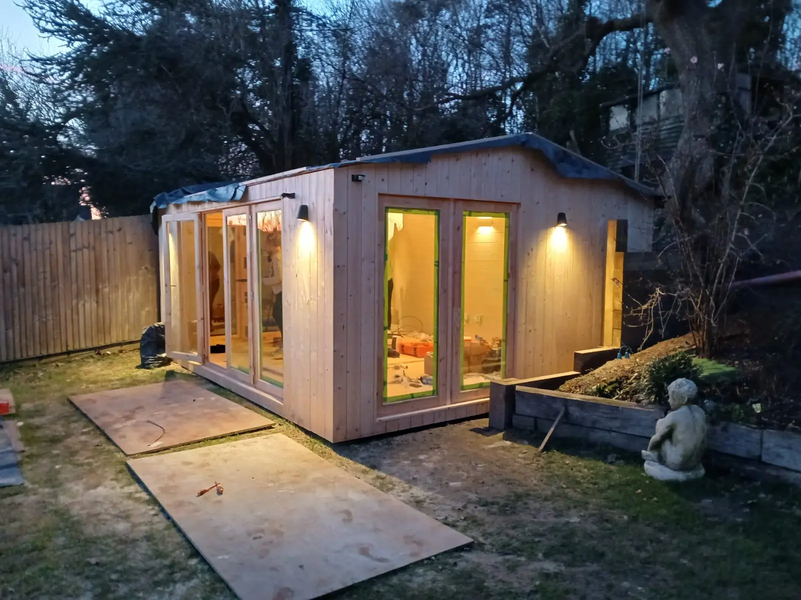Finished timber garden room with exterior lighting